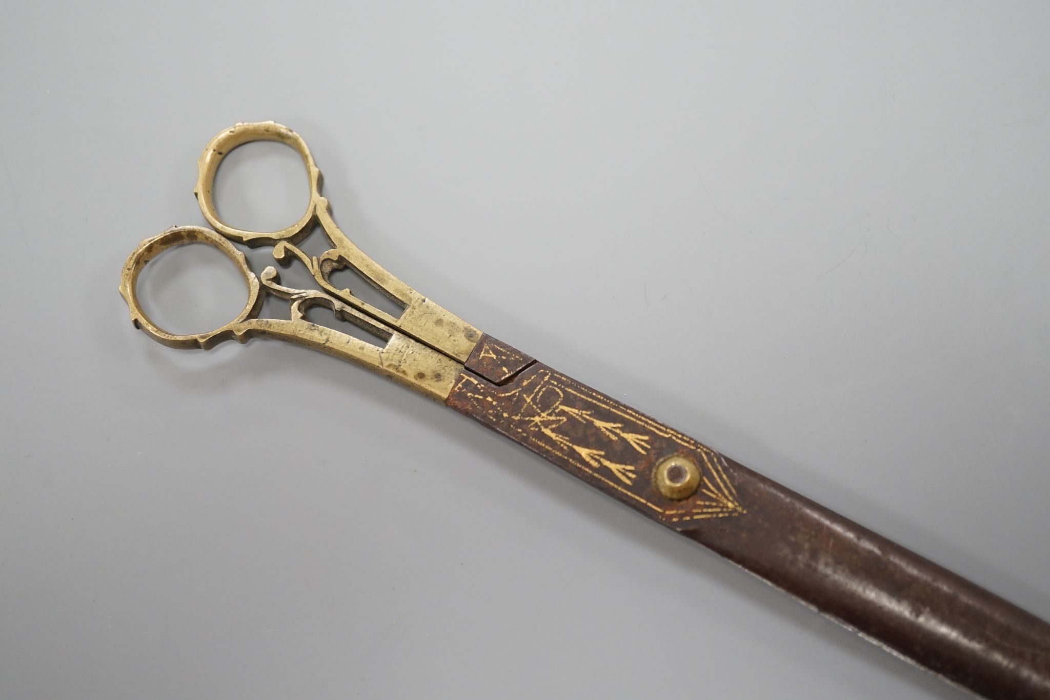 A pair of Ottoman gold damascened iron scissors, 23 cms long.